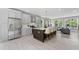 Modern kitchen with stainless steel appliances and a large island with seating, open to the living area at 101 Fairfield Ct, Atlanta, GA 30314