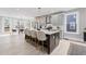 Open kitchen featuring a large island with counter seating, pendant lighting, and modern appliances at 101 Fairfield Ct, Atlanta, GA 30314