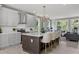 Open-concept kitchen with gray cabinets, stainless steel appliances, and an island with seating at 101 Fairfield Ct, Atlanta, GA 30314