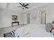 Bright main bedroom features a tray ceiling, ceiling fan, and gray vinyl flooring, plus en-suite bath at 101 Fairfield Ct, Atlanta, GA 30314