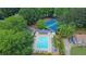Aerial view of a community pool and tennis courts, perfect for recreation and relaxation at 1663 Willow Way, Woodstock, GA 30188