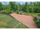 Spacious wooden deck in a lush backyard, perfect for outdoor gatherings and relaxation at 1663 Willow Way, Woodstock, GA 30188