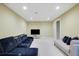 Finished basement with a comfortable seating area, perfect for entertaining or relaxing at 1663 Willow Way, Woodstock, GA 30188