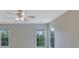 Bright bedroom with a ceiling fan and two large windows offering exterior views at 1663 Willow Way, Woodstock, GA 30188