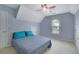 Bedroom with vaulted ceiling, light blue walls, a ceiling fan, and a comfortable bed at 1663 Willow Way, Woodstock, GA 30188