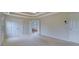 Spacious bedroom with neutral walls, plush carpet, and an en-suite bathroom at 1663 Willow Way, Woodstock, GA 30188