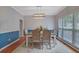 Bright dining room with a stylish rug, modern light fixture, and neutral wall colors at 1663 Willow Way, Woodstock, GA 30188