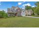 Beautiful home featuring a well-maintained lawn and a classic architectural style at 1663 Willow Way, Woodstock, GA 30188