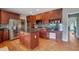 A well-equipped kitchen with stainless steel appliances and an island with a black countertop at 1663 Willow Way, Woodstock, GA 30188
