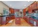 Spacious kitchen featuring cherry cabinets, stainless steel appliances, and a center island at 1663 Willow Way, Woodstock, GA 30188