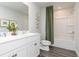 Well-lit bathroom features a double sink vanity, neutral walls and a shower and tub combination at 1781 Jordan Brook Dr, Lawrenceville, GA 30043