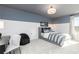 Cozy bedroom features a two-tone paint job and is decorated with gamer themed decor at 1781 Jordan Brook Dr, Lawrenceville, GA 30043