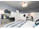 Stylish bedroom is decorated with a black dresser and gaming themed decor throughout at 1781 Jordan Brook Dr, Lawrenceville, GA 30043