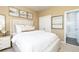 Comfortable bedroom featuring a plush bed with soft linens and decorative artwork at 1781 Jordan Brook Dr, Lawrenceville, GA 30043