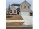 Stunning two-story home with a brick facade, an attached garage, and newly installed lawn at 1781 Jordan Brook Dr, Lawrenceville, GA 30043
