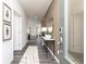 Inviting hallway featuring wood floors, neutral walls, an oval mirror and tasteful decor at 1781 Jordan Brook Dr, Lawrenceville, GA 30043