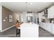 Open kitchen with a center island, stainless steel appliances, and stylish pendant lights create an inviting atmosphere at 1781 Jordan Brook Dr, Lawrenceville, GA 30043