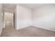 A bright bedroom with carpet and ensuite access to the bathroom at 3919 Shelleydale Dr, Powder Springs, GA 30127