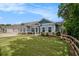 Attractive single-story home with a green lawn and a wooden fence alongside the property at 3919 Shelleydale Dr, Powder Springs, GA 30127