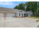 Single-story home with a two-car garage and a wide driveway providing ample parking space at 3919 Shelleydale Dr, Powder Springs, GA 30127