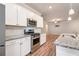Bright kitchen with granite counters, stainless appliances, and white cabinets at 3919 Shelleydale Dr, Powder Springs, GA 30127
