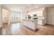 Open kitchen featuring white cabinets, stainless steel appliances, and breakfast bar at 3919 Shelleydale Dr, Powder Springs, GA 30127