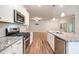 Modern kitchen with granite countertops, stainless appliances, and open layout at 3919 Shelleydale Dr, Powder Springs, GA 30127