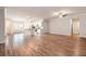 Hardwood floors and ceiling fan in an open space with white cabinets and stainless steel appliances at 3919 Shelleydale Dr, Powder Springs, GA 30127