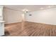 Open-concept layout with hardwood floors, a ceiling fan, and a TV mount on the wall at 3919 Shelleydale Dr, Powder Springs, GA 30127