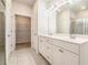 Bright bathroom boasts double sinks, tile flooring, and walk-in closet access at 3919 Shelleydale Dr, Powder Springs, GA 30127