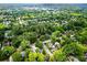 Beautiful aerial view of a neighborhood featuring tree-lined streets and diverse housing at 574 Chicasaw Ne Dr, Marietta, GA 30060