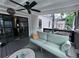 Outdoor porch with comfortable seating, ceiling fan and string lights at 574 Chicasaw Ne Dr, Marietta, GA 30060