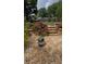 Lovely backyard with stone steps, decorative rock, tasteful landscaping and flowering plants at 574 Chicasaw Ne Dr, Marietta, GA 30060