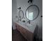 Stylish bathroom with double sinks, modern fixtures, and oval mirrors at 574 Chicasaw Ne Dr, Marietta, GA 30060