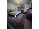 Cozy bedroom with a fireplace, decorative rug, and comfortable bedding at 574 Chicasaw Ne Dr, Marietta, GA 30060