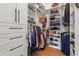 A walk-in closet provides ample storage with drawers, shelves, and hanging rods for organization at 574 Chicasaw Ne Dr, Marietta, GA 30060