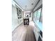 Bright dining area with built-in cabinets, wood floors, and access to outdoor deck at 574 Chicasaw Ne Dr, Marietta, GA 30060