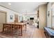 Spacious dining room with a large wooden table, hardwood floors, and a view of the living room at 574 Chicasaw Ne Dr, Marietta, GA 30060