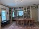 Charming dining room with built-in bookshelves, exposed kitchen view and dining table at 574 Chicasaw Ne Dr, Marietta, GA 30060