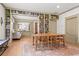 Inviting dining room with a large wooden table, built-in bookshelves, and an open view to the living room at 574 Chicasaw Ne Dr, Marietta, GA 30060