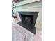 Close-up of a stylish fireplace with black herringbone tile at 574 Chicasaw Ne Dr, Marietta, GA 30060