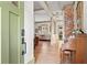 Bright foyer with hardwood floors, brick accent wall, with views into the living room at 574 Chicasaw Ne Dr, Marietta, GA 30060