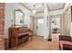 Elegant foyer with hardwood floors, classic piano, beautiful trim, and stylish decor at 574 Chicasaw Ne Dr, Marietta, GA 30060