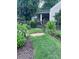 Charming front yard with landscaped walkway, garden gate and stone path at 574 Chicasaw Ne Dr, Marietta, GA 30060