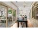 Bright kitchen featuring a large island, modern appliances, white cabinetry, and sliding doors to the porch at 574 Chicasaw Ne Dr, Marietta, GA 30060