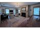 Comfortable living room with fireplace, chandelier, and cozy seating area at 574 Chicasaw Ne Dr, Marietta, GA 30060