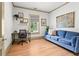 Office space with a desk, blue sofa, hardwood floors and natural light at 574 Chicasaw Ne Dr, Marietta, GA 30060