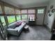 Cozy sunroom with ample natural light, comfortable seating, and woven blinds at 574 Chicasaw Ne Dr, Marietta, GA 30060
