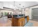 Bar featuring a black granite countertop with stainless steel dishwasher and a view to the living room at 8340 Colonial Pl, Duluth, GA 30097