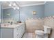 Bathroom with a tile backsplash and white cabinets at 8340 Colonial Pl, Duluth, GA 30097